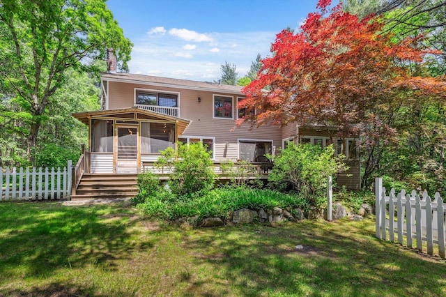 10 Cranberry Rd, Keene, NH 03431 - rear view of house featuring a sunroom, a chimney, and a deck
