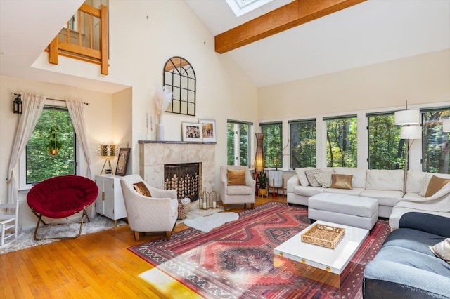 10 Cranberry Rd, Keene, NH 03431 - living room featuring high vaulted ceiling, hardwood / wood-style flooring, a skylight, beamed ceiling, and a fireplace