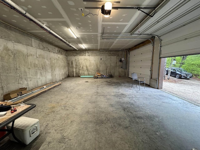 149 Sleepy Hollow Rd, Wakefield, NH 03830 - garage featuring a garage door opener and electric panel