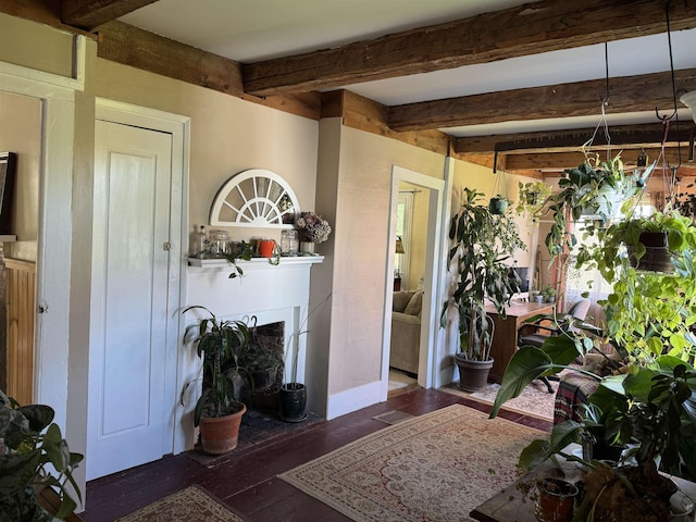 45 Effingham Rd, Ossipee, NH 03864 - living area with beam ceiling, a fireplace with flush hearth, and wood finished floors