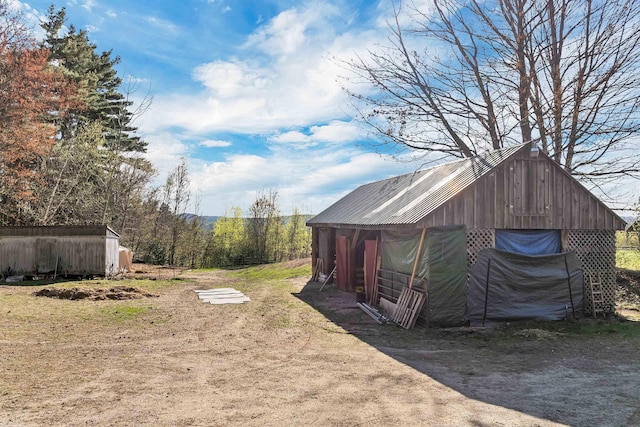 45 Effingham Rd, Ossipee, NH 03864 - view of yard featuring an outdoor structure and a garage
