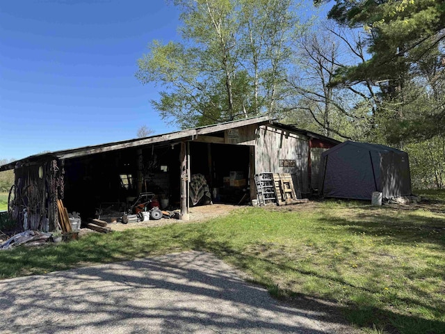 45 Effingham Rd, Ossipee, NH 03864 - view of pole building featuring a lawn
