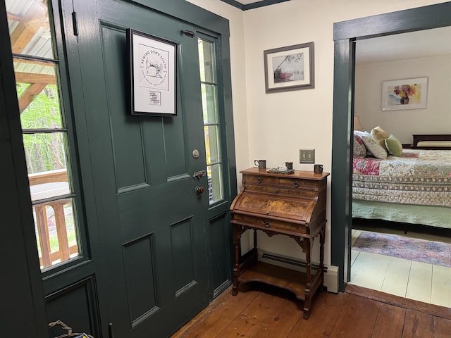 197 Circuit Rd, Ossipee, NH 03864 - entryway with hardwood / wood-style flooring, healthy amount of natural light, and baseboard heating