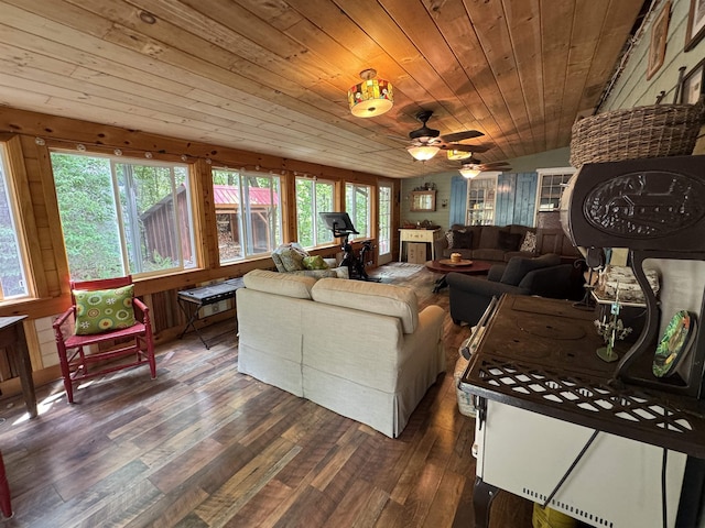 197 Circuit Rd, Ossipee, NH 03864 - living area with healthy amount of natural light, dark wood-style flooring, wooden ceiling, and a ceiling fan