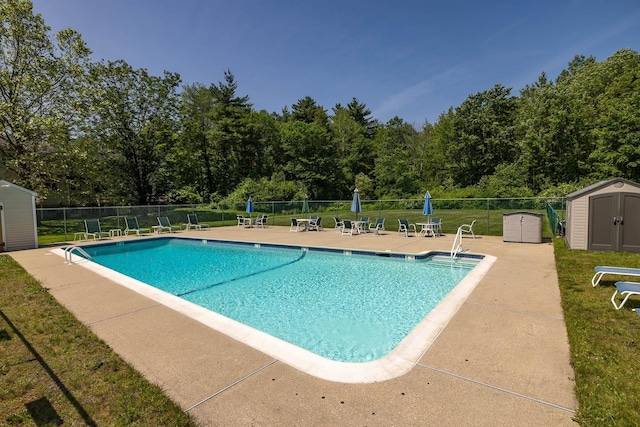 46 Pine Meadows Dr, Exeter, NH 03833 - community pool with a shed and a patio area