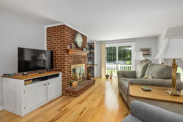 46 Pine Meadows Dr, Exeter, NH 03833 - living room featuring a fireplace and light wood-style floors