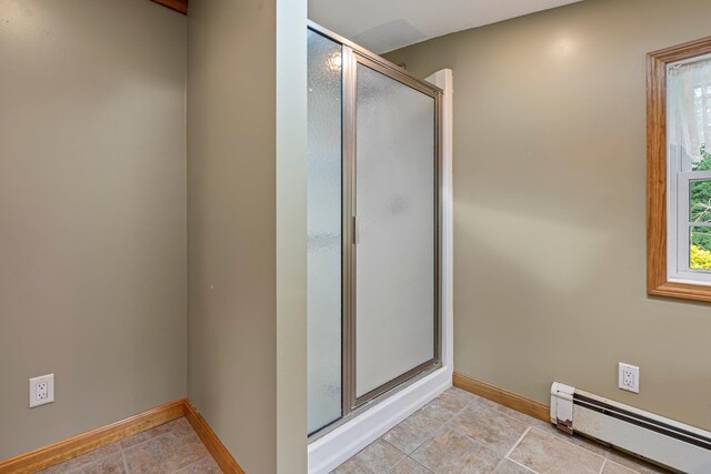 429 Critchett Rd, Candia, NH 03034 - bathroom featuring a baseboard heating unit, a shower stall, and tile patterned floors