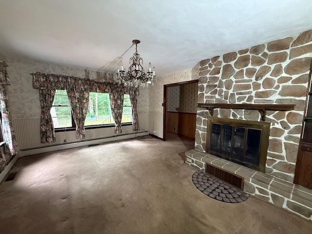 224 E Dunbarton Rd, Goffstown, NH 03045 - unfurnished living room with a chandelier, a wainscoted wall, a fireplace, baseboard heating, and wallpapered walls