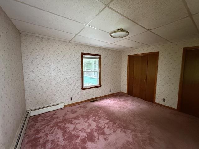 224 E Dunbarton Rd, Goffstown, NH 03045 - unfurnished bedroom with a baseboard heating unit, a paneled ceiling, carpet, a closet, and wallpapered walls
