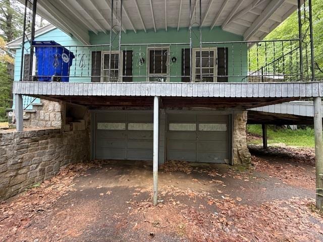 224 E Dunbarton Rd, Goffstown, NH 03045 - rear view of property with a garage, driveway, and stone siding
