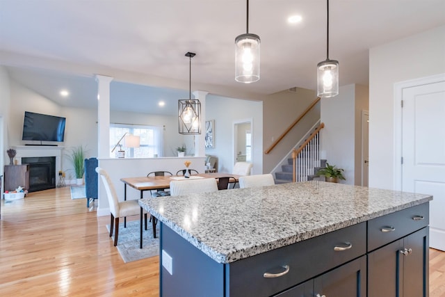 21 Catesby Ln, Londonderry, NH 03053 - kitchen with light wood-style flooring, a center island, decorative light fixtures, and recessed lighting