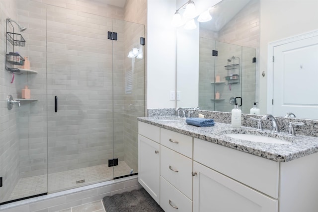 21 Catesby Ln, Londonderry, NH 03053 - bathroom with double vanity and a shower stall