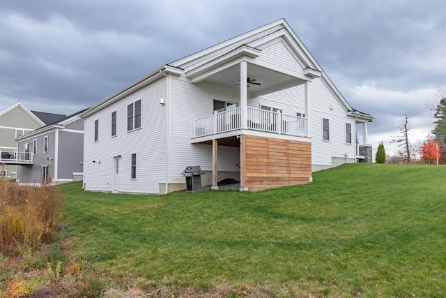 21 Catesby Ln, Londonderry, NH 03053 - back of property with a yard and ceiling fan