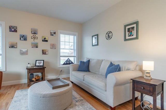 21 Catesby Ln, Londonderry, NH 03053 - living area with light wood-type flooring and baseboards