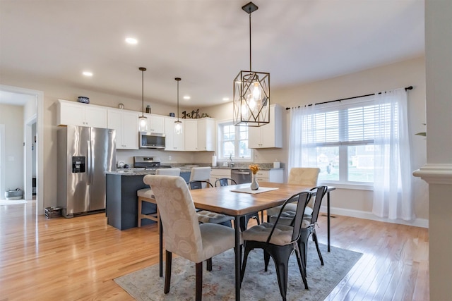 21 Catesby Ln, Londonderry, NH 03053 - dining space featuring light wood-style flooring and recessed lighting