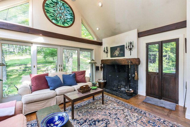 133 Hay Hill Rd, Francestown, NH 03043 - living room with hardwood / wood-style floors, high vaulted ceiling, a fireplace with flush hearth, and recessed lighting