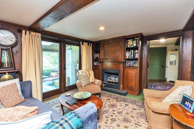 133 Hay Hill Rd, Francestown, NH 03043 - living room featuring a fireplace with raised hearth, wooden walls, and beam ceiling