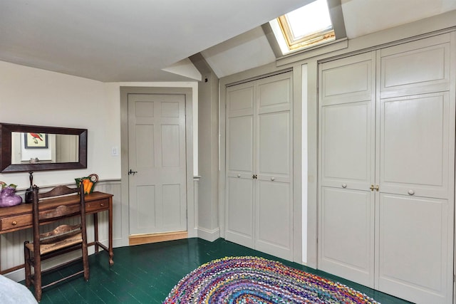133 Hay Hill Rd, Francestown, NH 03043 - bedroom with a wainscoted wall, a skylight, and dark wood finished floors