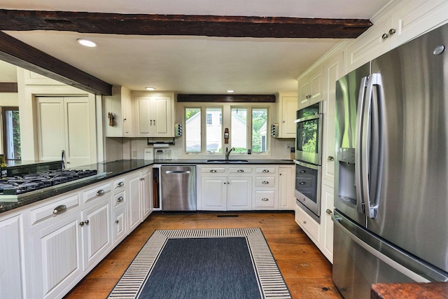 133 Hay Hill Rd, Francestown, NH 03043 - kitchen featuring stainless steel appliances, beam ceiling, dark countertops, dark wood-style floors, and white cabinetry