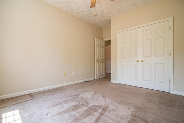 32 Saint Andrews Way, Londonderry, NH 03053 - unfurnished bedroom featuring carpet flooring, a closet, and ceiling fan