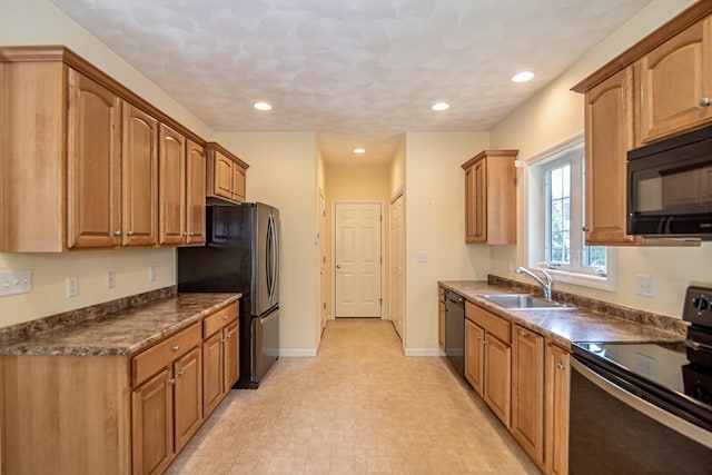32 Saint Andrews Way, Londonderry, NH 03053 - kitchen with black appliances, dark countertops, recessed lighting, and brown cabinets