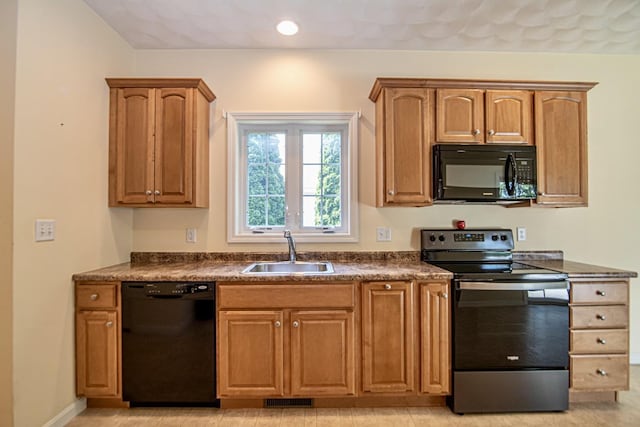 32 Saint Andrews Way, Londonderry, NH 03053 - kitchen featuring black appliances, dark countertops, recessed lighting, and brown cabinets