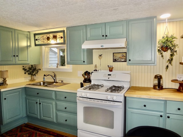 1 Northbrook Rd, Tilton, NH 03276 - kitchen featuring white range with gas stovetop, under cabinet range hood, and green cabinetry