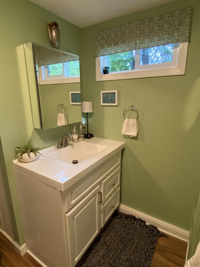 1 Northbrook Rd, Tilton, NH 03276 - bathroom with vanity and wood finished floors