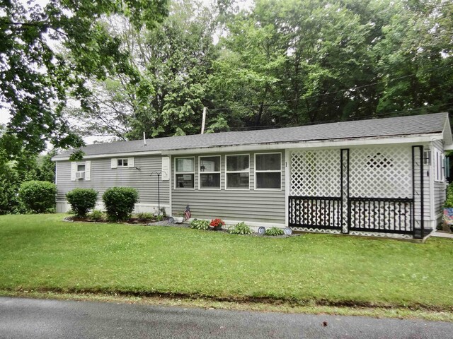1 Northbrook Rd, Tilton, NH 03276 - view of front of property featuring a front yard and a shingled roof