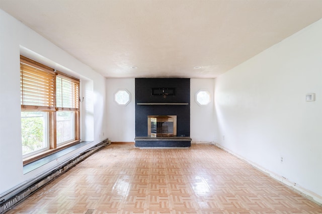 5 Gayle Dr Unit L, Derry, NH 03038 - unfurnished living room with a baseboard heating unit and a fireplace