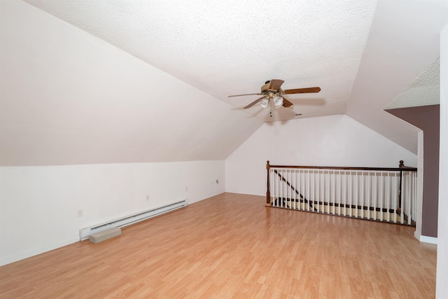 5 Gayle Dr Unit L, Derry, NH 03038 - additional living space featuring baseboard heating, wood finished floors, a ceiling fan, and vaulted ceiling