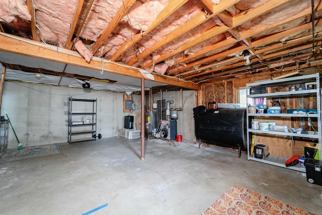 5 Gayle Dr Unit L, Derry, NH 03038 - unfinished basement featuring oil tank, gas water heater, electric panel, and a water pressure tank