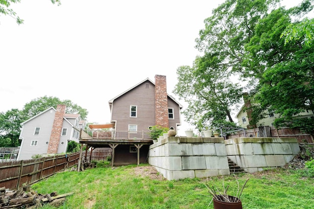 5 Gayle Dr Unit L, Derry, NH 03038 - rear view of house featuring a fenced backyard and a chimney