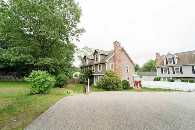 5 Gayle Dr Unit L, Derry, NH 03038 - view of side of property with a chimney and asphalt driveway