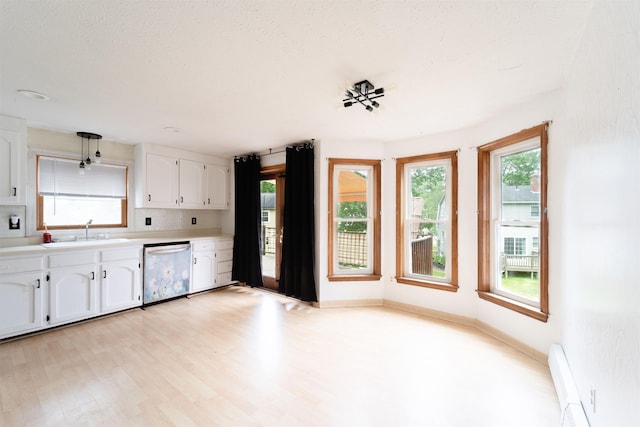5 Gayle Dr Unit L, Derry, NH 03038 - kitchen with dishwasher, white cabinets, light countertops, light wood finished floors, and pendant lighting
