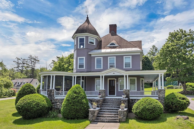 3 Fisher Pl, Claremont, NH 03743 - victorian-style house featuring a chimney, a porch, a front yard, and stairs