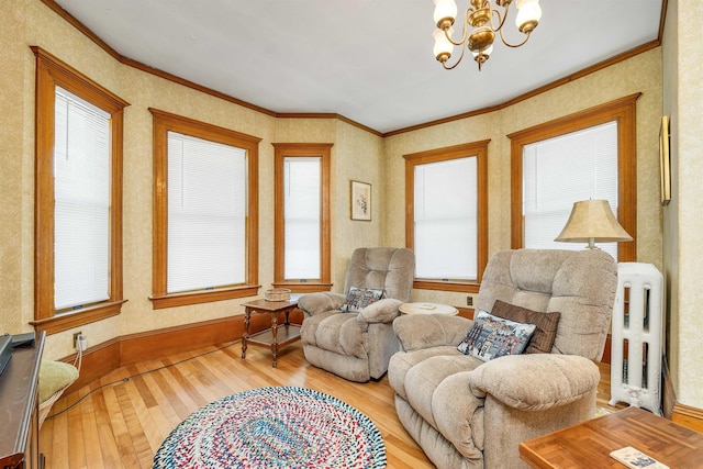 3 Fisher Pl, Claremont, NH 03743 - living area with radiator heating unit, hardwood / wood-style floors, a chandelier, and ornamental molding