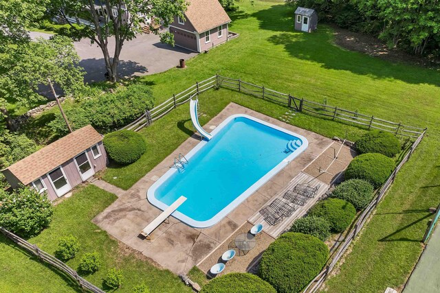 3 Fisher Pl, Claremont, NH 03743 - view of pool featuring a water slide, an outbuilding, a diving board, and a fenced backyard