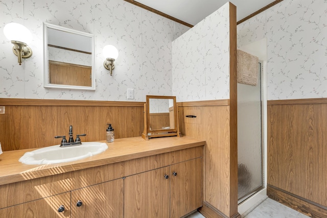 3 Fisher Pl, Claremont, NH 03743 - full bath with wainscoting, vanity, a shower stall, crown molding, and wallpapered walls