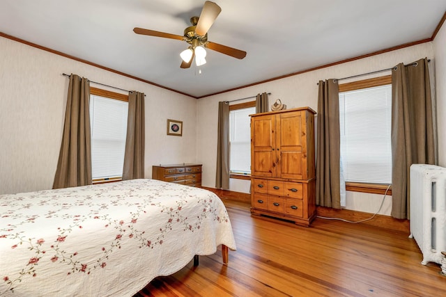 3 Fisher Pl, Claremont, NH 03743 - bedroom with ornamental molding, radiator, light wood-style floors, and a ceiling fan