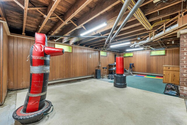 3 Fisher Pl, Claremont, NH 03743 - below grade area featuring a baseboard radiator and wooden walls