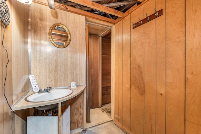3 Fisher Pl, Claremont, NH 03743 - bathroom with wood walls and concrete floors