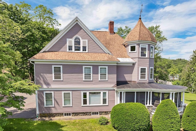3 Fisher Pl, Claremont, NH 03743 - back of property featuring a chimney, a sunroom, and a shingled roof