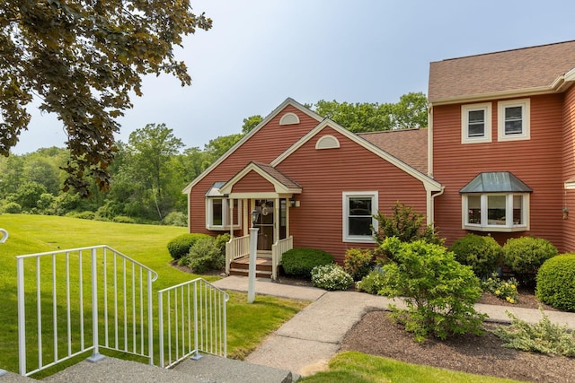 111 Katie Ln, Dover, NH 03820 - view of front of home with a front yard and roof with shingles