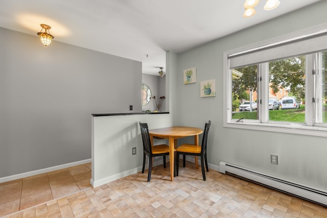 111 Katie Ln, Dover, NH 03820 - dining space with a baseboard radiator and stone finish floors