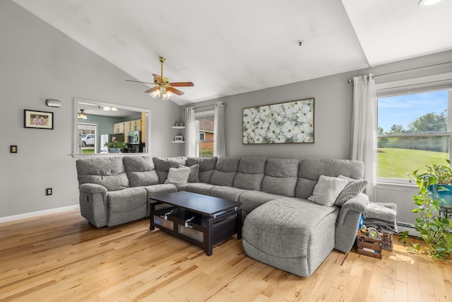 111 Katie Ln, Dover, NH 03820 - living area featuring vaulted ceiling, healthy amount of natural light, ceiling fan, and light wood-style flooring