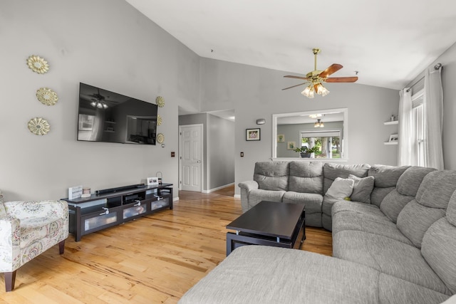 111 Katie Ln, Dover, NH 03820 - living area with lofted ceiling, a ceiling fan, and light wood-style flooring