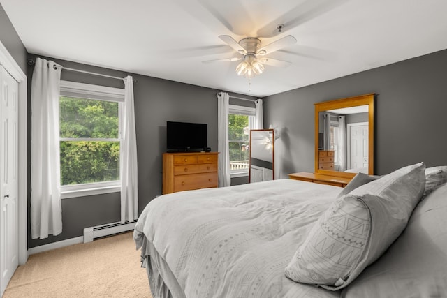 111 Katie Ln, Dover, NH 03820 - carpeted bedroom with a baseboard heating unit and a ceiling fan