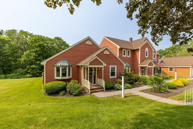 111 Katie Ln, Dover, NH 03820 - view of front of house featuring a chimney and a front yard