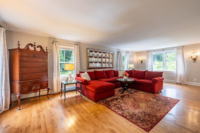 146 Old Sandown Rd, Chester, NH 03036 - living area with healthy amount of natural light and light wood finished floors